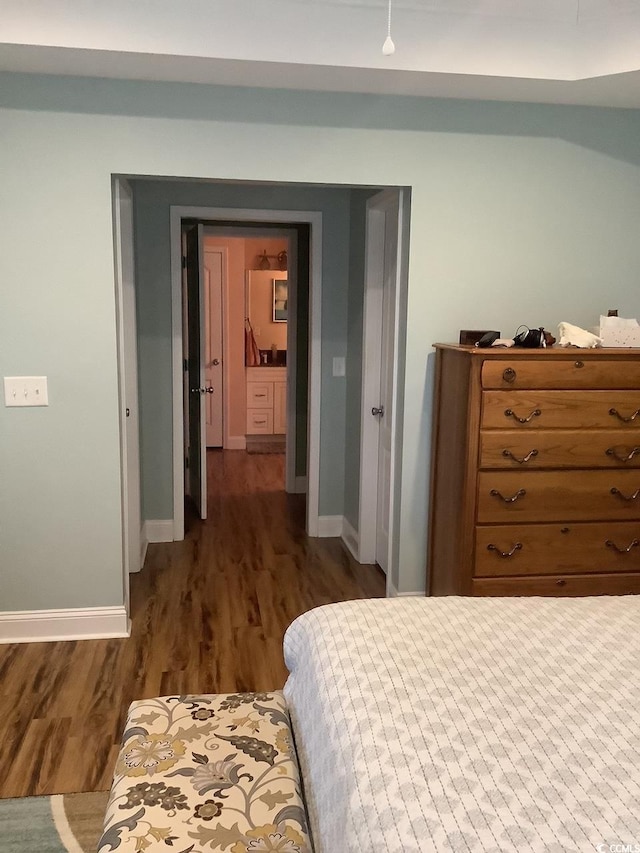 bedroom featuring dark hardwood / wood-style flooring