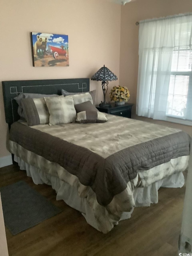 bedroom with wood-type flooring