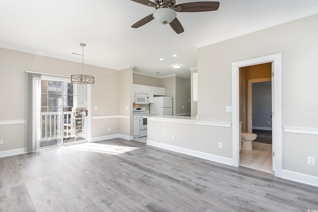 unfurnished living room featuring ceiling fan with notable chandelier, ornamental molding, and light hardwood / wood-style floors