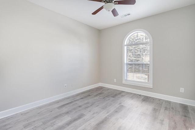 spare room featuring ceiling fan and light wood-type flooring