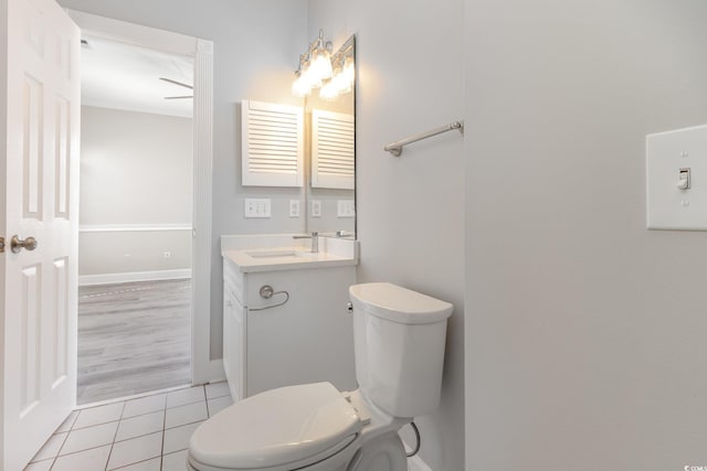 bathroom with vanity, tile patterned floors, and toilet