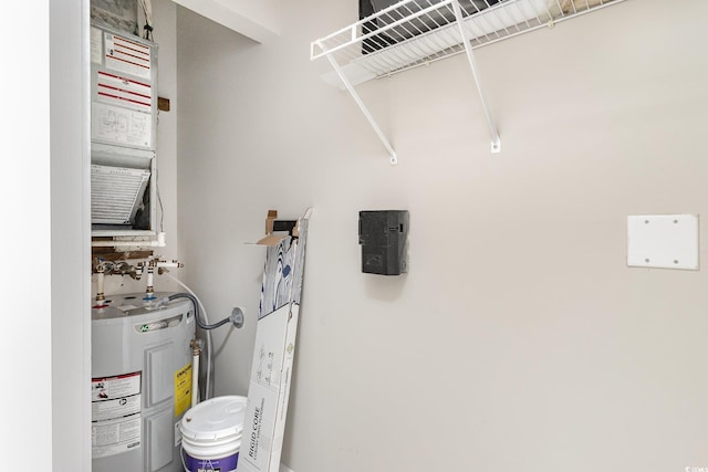 laundry area featuring electric water heater