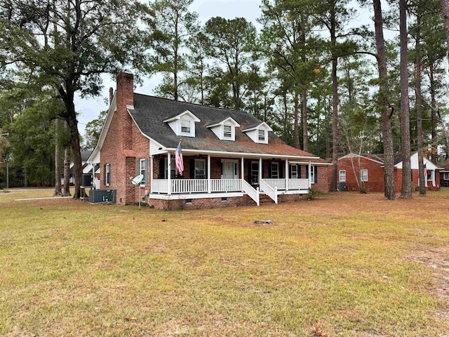 view of front facade with a front yard and covered porch