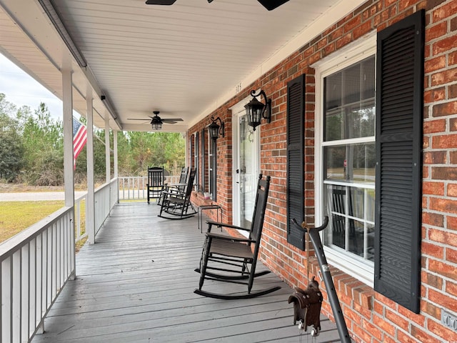 wooden deck with ceiling fan and covered porch