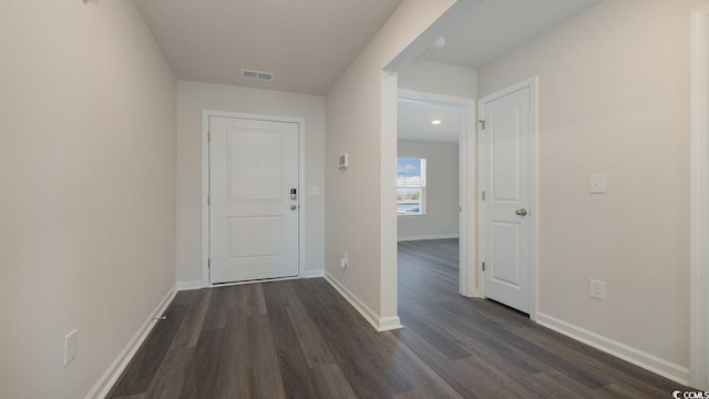 hallway with dark hardwood / wood-style floors