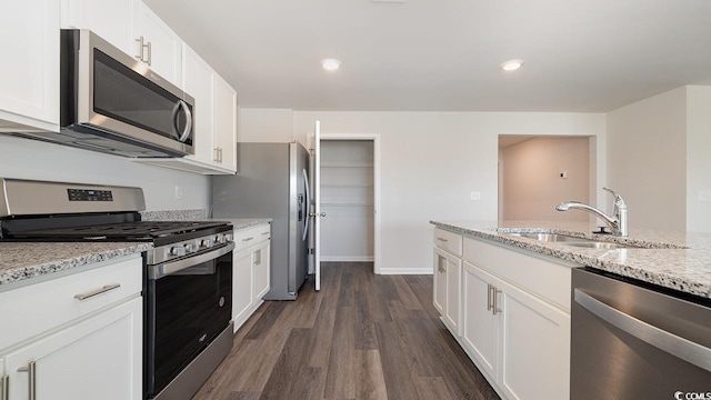 kitchen featuring appliances with stainless steel finishes, sink, and white cabinets