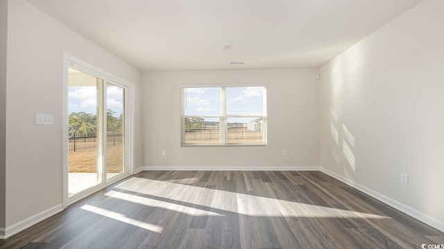 empty room featuring dark hardwood / wood-style floors