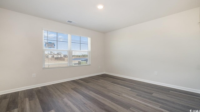 empty room featuring dark hardwood / wood-style floors