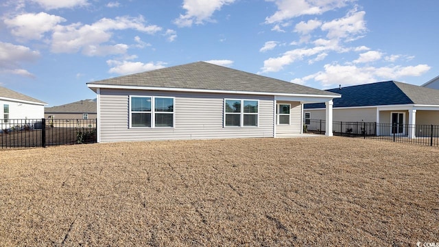 back of property featuring a yard