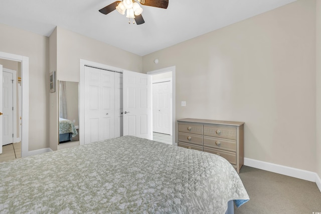 bedroom with light carpet, a closet, and ceiling fan