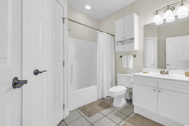 full bathroom with vanity, tile patterned floors, toilet, and shower / bath combo with shower curtain