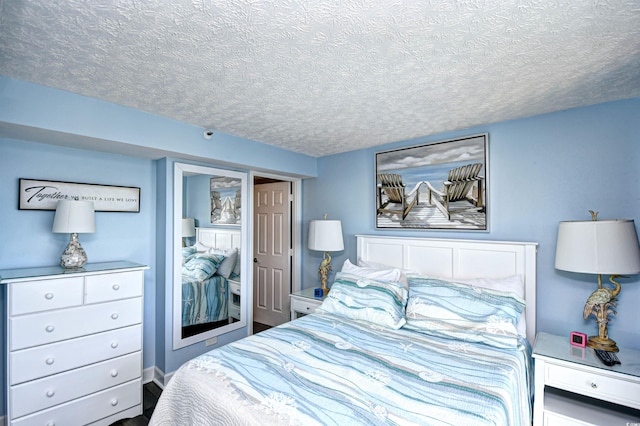 bedroom featuring a textured ceiling