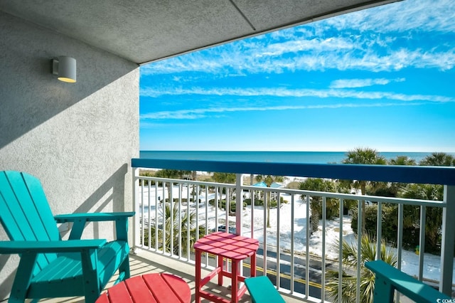 balcony featuring a water view