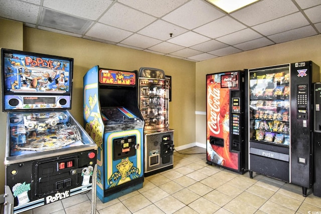 game room featuring a drop ceiling and light tile patterned floors