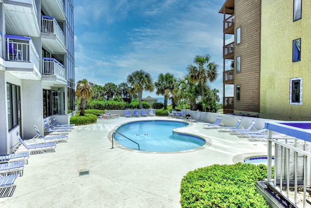 view of pool featuring a patio area