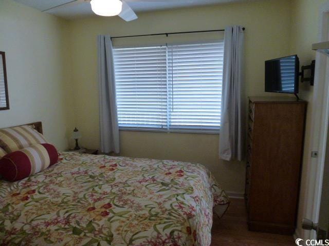 2710 Ocean Blvd S Unit 406, Myrtle Beach, SC 29577 - bedroom featuring a ceiling fan