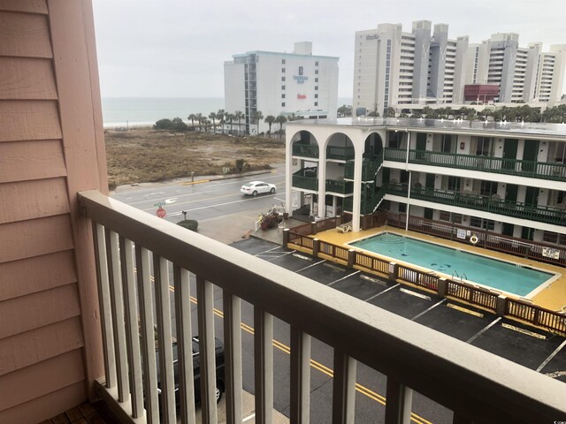 balcony featuring a water view