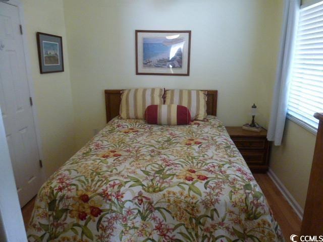 bedroom featuring wood-type flooring