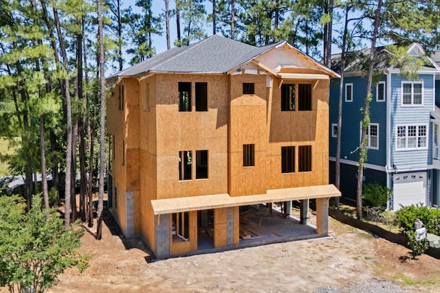 301 Crossing Ct, Myrtle Beach, SC 29588 - view of front facade with dirt driveway, a carport, and stucco siding