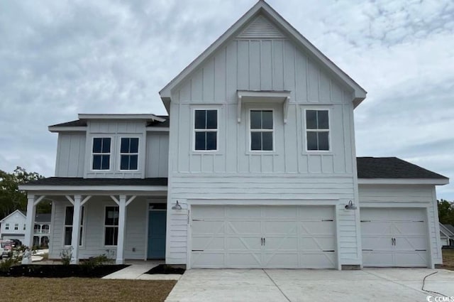 modern farmhouse featuring a garage and covered porch