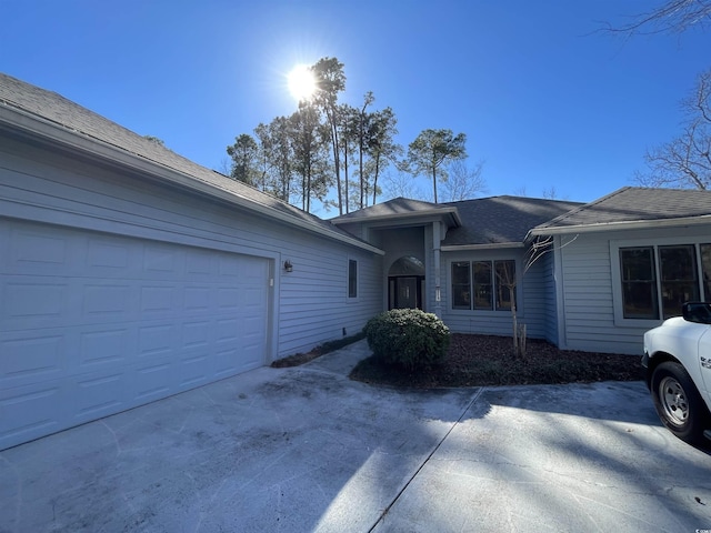 single story home featuring a garage