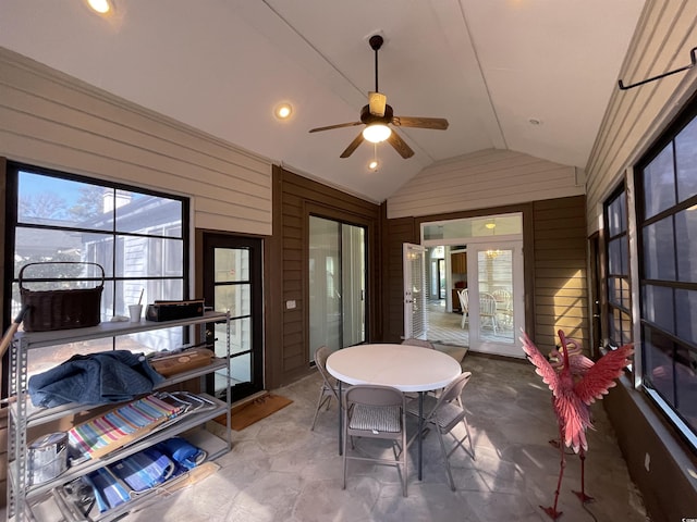 sunroom / solarium with ceiling fan and lofted ceiling