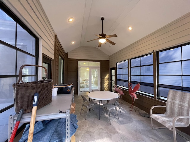 sunroom / solarium with lofted ceiling and ceiling fan