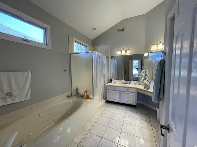 bathroom with tile patterned flooring, vanity, vaulted ceiling, and independent shower and bath