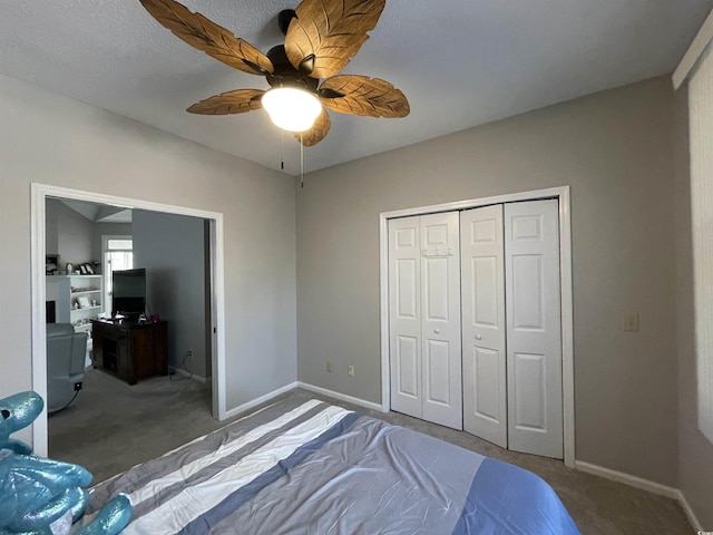 bedroom featuring carpet flooring, ceiling fan, and a closet