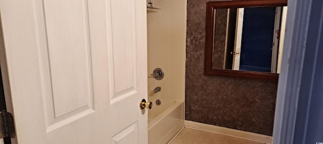 bathroom featuring tile patterned flooring and tub / shower combination