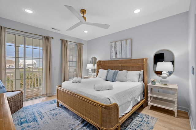 bedroom with access to exterior, light hardwood / wood-style floors, and ceiling fan