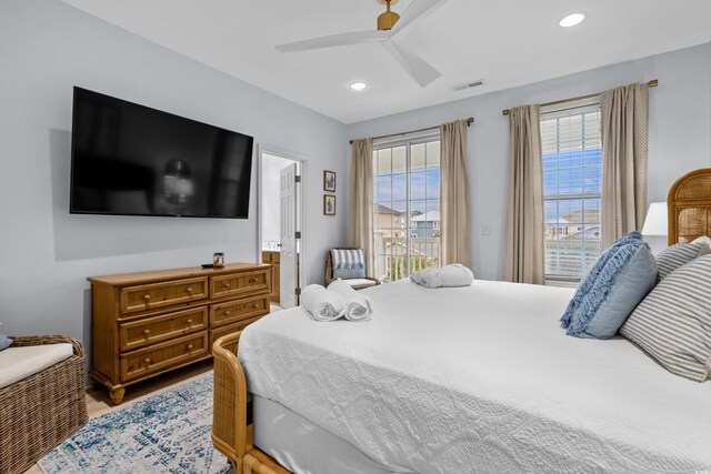 bedroom featuring ensuite bathroom and ceiling fan