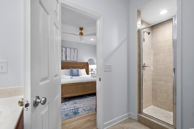 bathroom with vanity and a shower with shower door