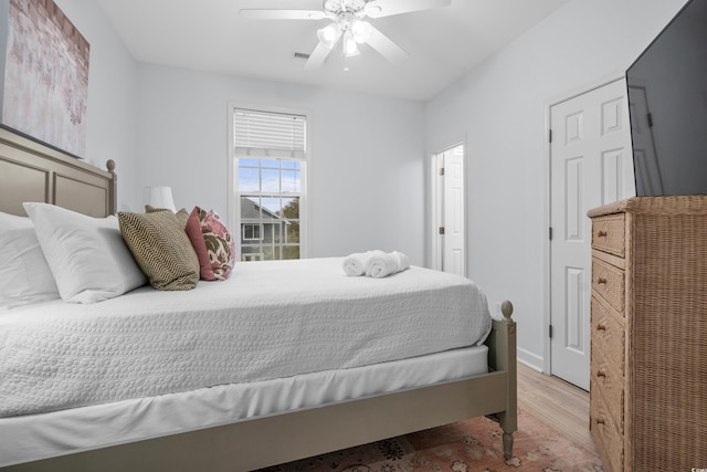 bedroom with ceiling fan and light wood-type flooring