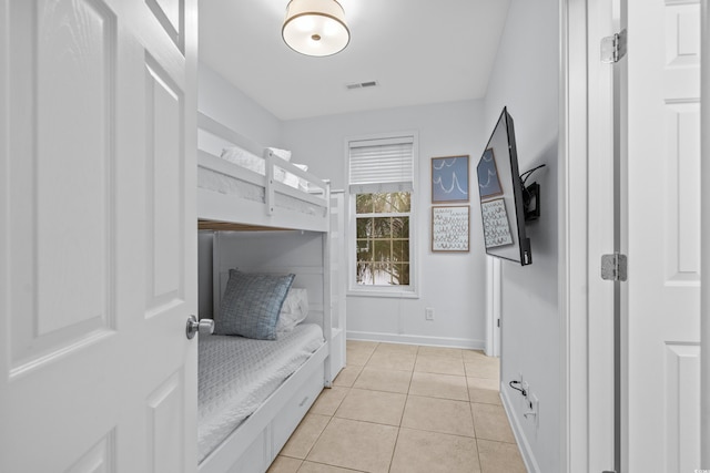 bedroom with light tile patterned flooring