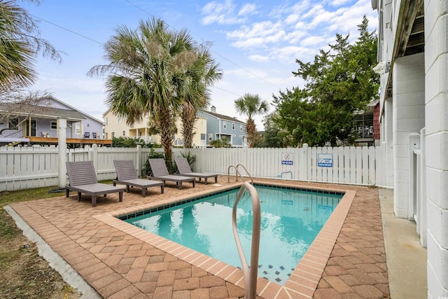 view of swimming pool with a patio