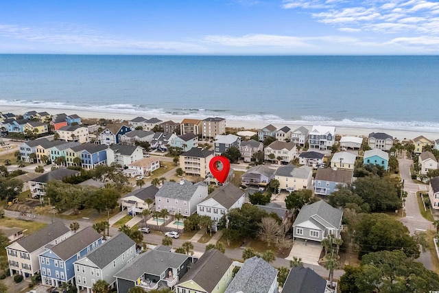 aerial view featuring a water view and a beach view