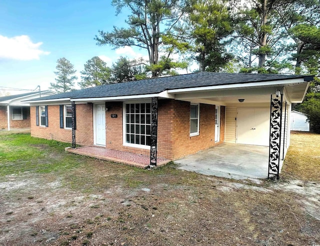 ranch-style house featuring a carport