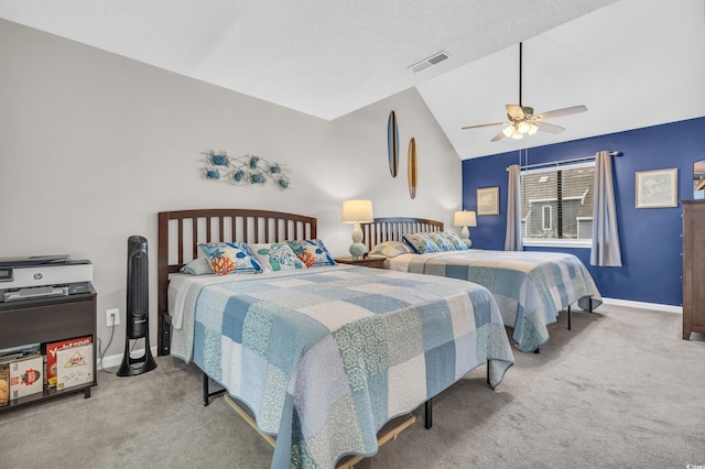 bedroom with lofted ceiling, carpet, visible vents, and ceiling fan