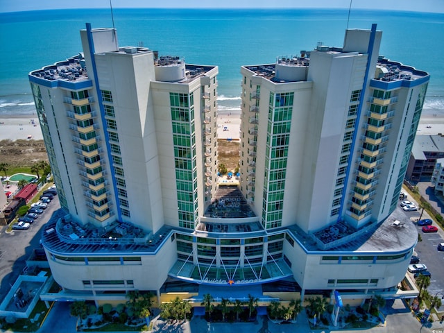 bird's eye view with a beach view and a water view