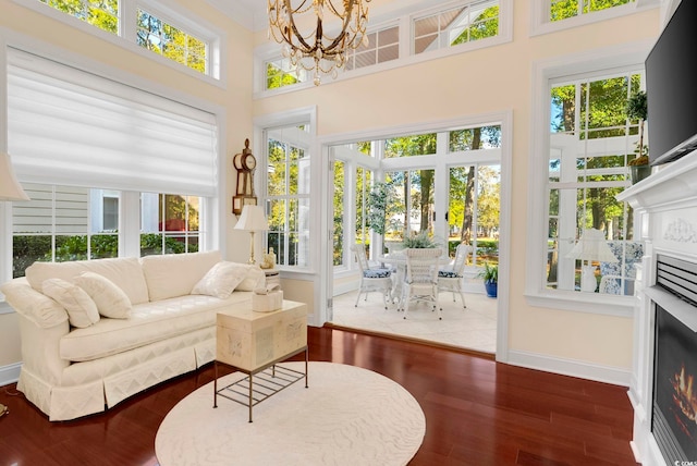 sunroom with an inviting chandelier and plenty of natural light