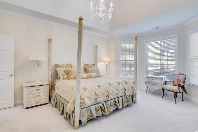 carpeted bedroom featuring an inviting chandelier, a tray ceiling, and ornamental molding