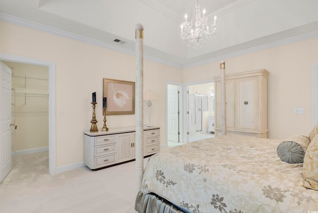 bedroom with crown molding, a walk in closet, light colored carpet, and a closet