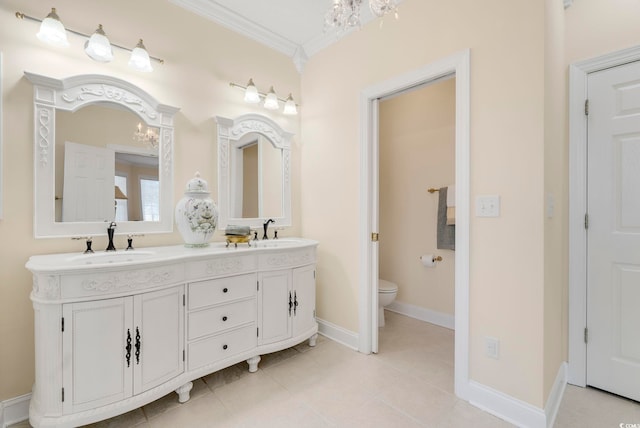 bathroom with an inviting chandelier, vanity, ornamental molding, tile patterned floors, and toilet