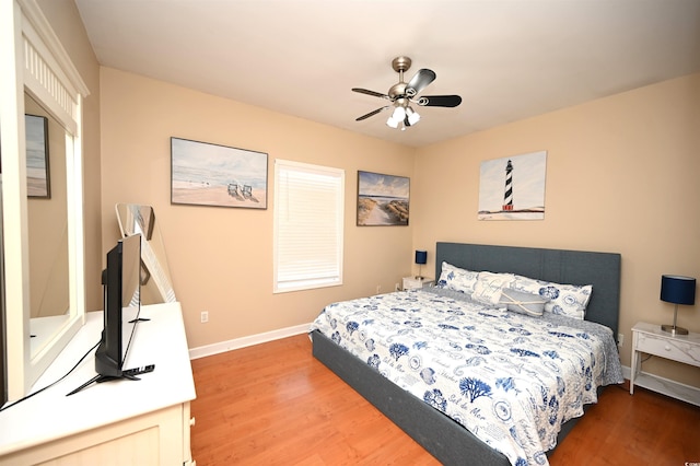 bedroom with hardwood / wood-style flooring and ceiling fan