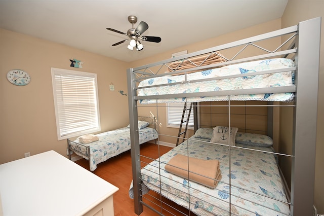 bedroom with hardwood / wood-style flooring and ceiling fan