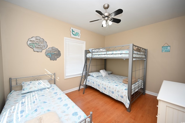 bedroom featuring hardwood / wood-style flooring and ceiling fan