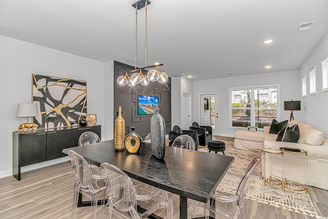 dining space featuring light hardwood / wood-style flooring