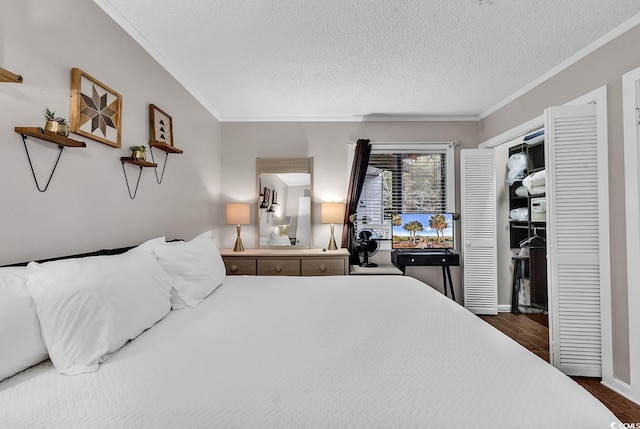 bedroom with crown molding, dark hardwood / wood-style floors, and a textured ceiling