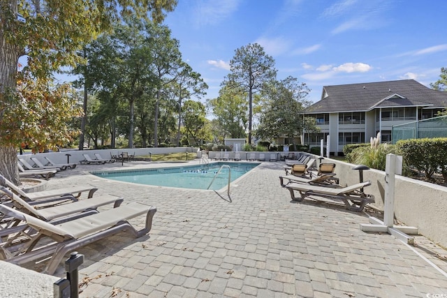 view of swimming pool with a patio